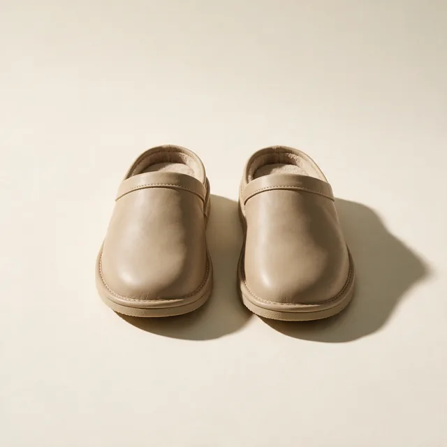 A pair of leather slippers with firm soles