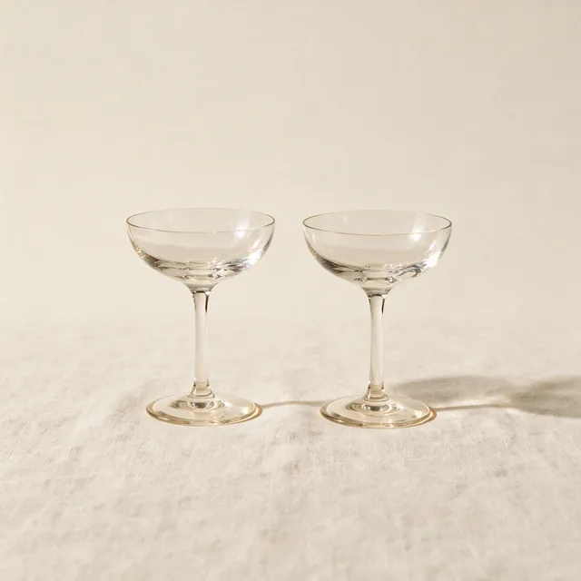 Two crystal champagne coupes side by side