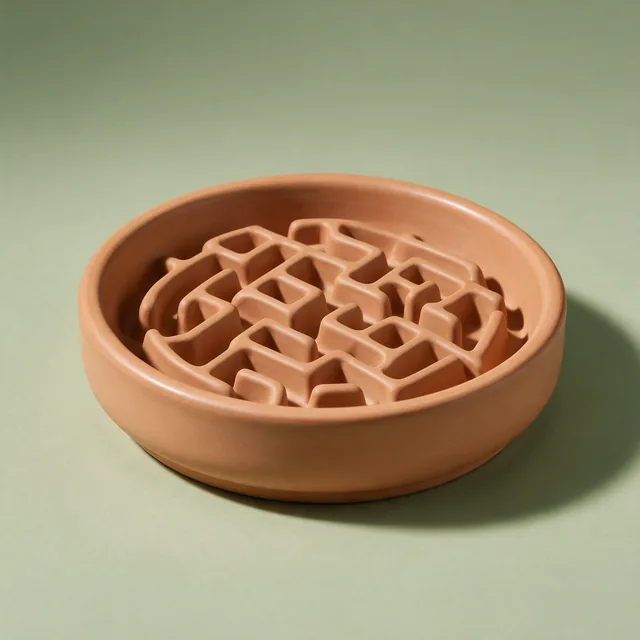 A slow feeder dog bowl showing its maze pattern