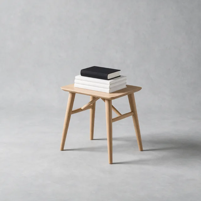 A small oak stack table with books on top